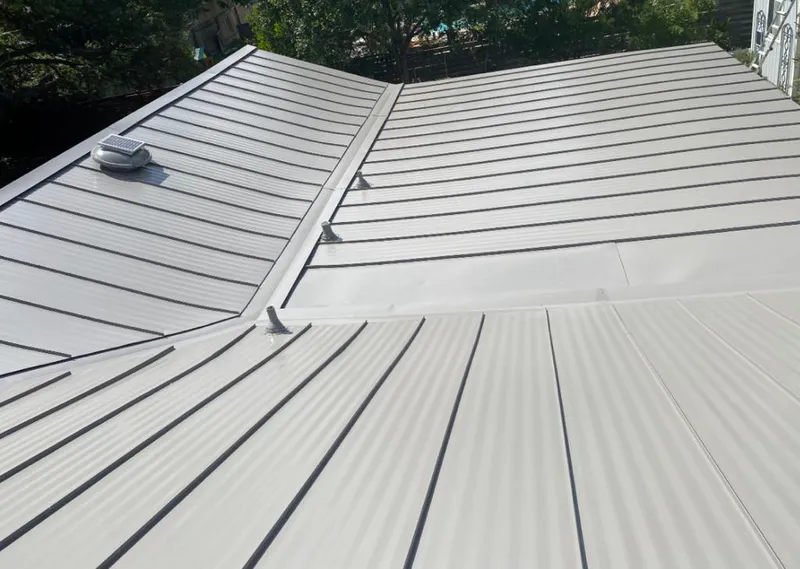 Solar attic fan installed on a metal roof for Roof Ventilation in Wailuku